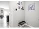 Entryway featuring charming dog-themed artwork, a modern thermostat, and convenient wall-mounted dog bowls at 6305 N Woodhaven Dr, McCordsville, IN 46055