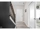 Hallway with hardwood floors and a staircase, providing a glimpse of the home's layout at 6305 N Woodhaven Dr, McCordsville, IN 46055