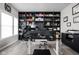 Contemporary home office with custom built-in shelving, sleek desk, and ample storage solutions at 6305 N Woodhaven Dr, McCordsville, IN 46055