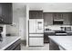 A modern kitchen featuring stainless steel appliances and granite countertops at 6305 N Woodhaven Dr, McCordsville, IN 46055