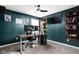 Stylish home office featuring modern decor, dual monitors, and custom shelves at 6305 N Woodhaven Dr, McCordsville, IN 46055