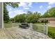 Inviting deck area for outdoor relaxation with seating amidst a backdrop of lush greenery and serene neighborhood views at 6518 Springview Dr, Avon, IN 46123