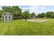 This backyard features a shed, basketball court, and lush green lawn at 6518 Springview Dr, Avon, IN 46123