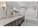 Bathroom featuring double vanity, decorative tile, and bathtub with shower at 6518 Springview Dr, Avon, IN 46123