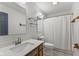 Bright bathroom featuring a well-lit mirror, vanity sink, and classic shower curtain, providing comfort and functionality at 6518 Springview Dr, Avon, IN 46123