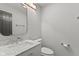 Modern powder room featuring sleek fixtures, vanity sink and convenient toilet, perfect for guests and everyday use at 6518 Springview Dr, Avon, IN 46123