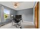 Comfortable bedroom featuring a ceiling fan, window with view, and versatile office setup, perfect for work and relaxation at 6518 Springview Dr, Avon, IN 46123