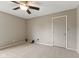 Neutrally decorated bedroom with a ceiling fan, closet and ample space, offering a serene and comfortable retreat at 6518 Springview Dr, Avon, IN 46123