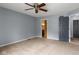 Spacious bedroom features a ceiling fan, gray walls, and two closets at 6518 Springview Dr, Avon, IN 46123