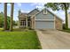 Charming brick and siding home with a well-manicured lawn and a two-car garage at 6518 Springview Dr, Avon, IN 46123