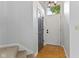 Bright foyer with parquet floor, white door, neutral walls, and staircase at 6518 Springview Dr, Avon, IN 46123