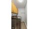 Efficient laundry room featuring wooden cabinets and modern washer and dryer set, perfect for streamlined chores at 6518 Springview Dr, Avon, IN 46123