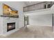 Spacious living room featuring a fireplace and high ceilings with a balcony view at 6518 Springview Dr, Avon, IN 46123