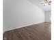 Spacious living room featuring sleek, modern flooring, a ceiling fan, and neutral paint, ready for your personal touch at 6963 N Abilene Way, McCordsville, IN 46055