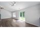 Bright living room showcases modern flooring, natural light, and sliding glass door, perfect for comfortable living at 6963 N Abilene Way, McCordsville, IN 46055