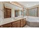 Well-lit bathroom with double sinks, a soaking tub, and an enclosed shower at 6983 White Oak Dr, Avon, IN 46123