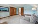 This bedroom features a blue accent wall, neutral carpet, and dark wood accents at 6983 White Oak Dr, Avon, IN 46123
