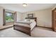Comfortable bedroom with a large window and a cozy bed setting at 6983 White Oak Dr, Avon, IN 46123