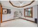 Light-filled bedroom with neutral carpeting, a ceiling fan, and decorative tray ceiling detail at 6983 White Oak Dr, Avon, IN 46123
