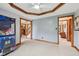 Spacious bedroom with wall-to-wall carpeting and multiple entrances to other rooms at 6983 White Oak Dr, Avon, IN 46123