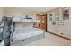 Charming bedroom featuring a bunk bed, fun artwork, and a doorway leading to another room at 6983 White Oak Dr, Avon, IN 46123