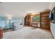 Versatile bonus room with large built-in bookshelves and a pull-out sofa at 6983 White Oak Dr, Avon, IN 46123