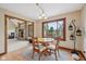 Cozy dining room featuring a wood table, decorative lighting, and a large window at 6983 White Oak Dr, Avon, IN 46123