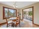 Bright dining area featuring a round table set, decorative window, and access to a sunroom at 6983 White Oak Dr, Avon, IN 46123