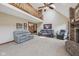 Spacious living room with high ceilings, fireplace, and comfortable seating arrangement at 6983 White Oak Dr, Avon, IN 46123