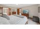 Spacious main bedroom with wood trim, television, and views to the hall at 6983 White Oak Dr, Avon, IN 46123
