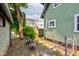 Cozy backyard area with mature tree, seating, and fence; perfect for outdoor relaxation and privacy at 715 Kessler Blvd E Dr, Indianapolis, IN 46220