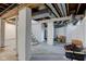 Unfinished basement with visible beams, white painted walls, and concrete flooring at 715 Kessler Blvd E Dr, Indianapolis, IN 46220