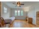 Bedroom featuring hardwood floors, a ceiling fan, and lots of natural light at 715 Kessler Blvd E Dr, Indianapolis, IN 46220