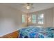 Bedroom featuring hardwood floors, a ceiling fan, and lots of natural light at 715 Kessler Blvd E Dr, Indianapolis, IN 46220