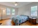 Bedroom featuring hardwood floors, a ceiling fan, and lots of natural light at 715 Kessler Blvd E Dr, Indianapolis, IN 46220