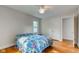 Bedroom featuring hardwood floors, a ceiling fan, and lots of natural light at 715 Kessler Blvd E Dr, Indianapolis, IN 46220