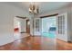 Open-concept dining room featuring an archway to a living space and French doors leading to a sunroom at 715 Kessler Blvd E Dr, Indianapolis, IN 46220