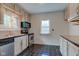 Functional kitchen with stainless steel appliances, ample cabinet space, and tile backsplash at 715 Kessler Blvd E Dr, Indianapolis, IN 46220
