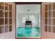 Bright sunroom with unique tile floors, large windows, and natural light, perfect for relaxing at 715 Kessler Blvd E Dr, Indianapolis, IN 46220