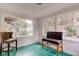 Sunroom with a seating area featuring large windows offering ample natural light at 715 Kessler Blvd E Dr, Indianapolis, IN 46220