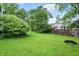 Open backyard with green grass and a fence that separates the other homes at 7430 Railway Ct, Indianapolis, IN 46256