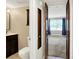 Open bathroom leading to bedroom showing a toilet, vanity and window in the bedroom at 7430 Railway Ct, Indianapolis, IN 46256