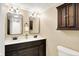 Bathroom showcasing double vanity, modern mirrors, and traditional cabinet at 7430 Railway Ct, Indianapolis, IN 46256