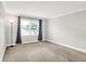 Bedroom with neutral carpeting, window with gray curtains and lots of light at 7430 Railway Ct, Indianapolis, IN 46256