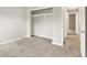 Bedroom with neutral carpet and paint plus walk in closet and entry to hallway at 7430 Railway Ct, Indianapolis, IN 46256