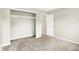 Cozy bedroom with neutral tones, carpet, closet, and door into adjoining space at 7430 Railway Ct, Indianapolis, IN 46256