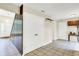 Hallway with tile flooring, white trim, coat rack, and staircase leading to upper level at 7430 Railway Ct, Indianapolis, IN 46256