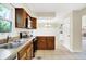 Kitchen with stainless steel appliances, tile flooring and natural light coming through the window at 7430 Railway Ct, Indianapolis, IN 46256