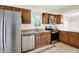 Kitchen with stainless steel appliances and lots of natural light coming through the window at 7430 Railway Ct, Indianapolis, IN 46256