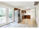 Spacious kitchen with stainless steel appliances, lots of light and double glass doors to back yard at 7430 Railway Ct, Indianapolis, IN 46256